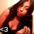 A pixelated image of a person with long dark hair wearing a black top, showing two sequential poses where the head shifts slightly left to right.