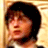 Static 48x48 pixel buddy icon showing a close-up of a person with dark hair against a light background, rendered in low-resolution pixel art style.