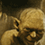 Two side-by-side animated frames from a buddy icon featuring Gollum and Smeagol characters from The Lord of the Rings, with pixelated low-resolution rendering on a gray background.