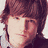 Two side-by-side pixelated portraits of young people with distinct hair colors and expressions, one with reddish-brown hair and neutral expression, the other with dark brown hair and smiling.