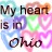 Pixelated static image with text 'My heart is in Ohio' over a multicolored background of blue, green, pink, and orange hues.