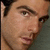A four- shows a person's face in sequential poses with subtle head and eye movements against a muted background