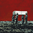 A 48x48 pixel buddy icon featuring a red background with white text and scissors, alongside a grayscale structure resembling stone pillars or ruins on the left side.
