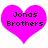 Two identical pink heart-shaped icons with black pixelated text reading "Jonas Brothers" on a white background.