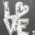 Pixelated grayscale icon with stylized white text 'LOVE' on dark gray background, featuring a heart symbol replacing the 'O' and a decorative swirl on the 'L'.
