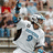 A pixelated image of a person in a white sports jersey with the number 9, standing in front of a blurred crowd background with text "IRISH BAR" overlaid.