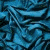 Blue fabric background with white text fragments reading "She She did She didn't didn't love i't love youve you anyyou anyway anyway way" in a scattered layout.
