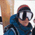 A person wearing a red headband, blue jacket, and white goggles appears in three showing slight head movement, followed by a figure in red clothing on a blue background, and finally a person with a black object near their face