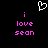 A black background displays a white pixelated heart above pink text reading 'i love sean' in two identical vertical
