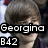 A static image of a person with brown hair and bangs, featuring overlaid text labels in a with partial background visible