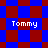 Four identical pixelated 'Tommy' text labels on a blue and red checkered background with diamond-shaped red