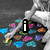 A static image shows a skeletal figure with colorful heart-shaped objects scattered around, overlaid with text and symbols.