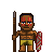 Pixel art of a warrior with brown skin, red face paint, holding a spear and shield, wearing yellow shorts against a gray background.