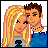 Pixelated cartoon couple icon with blonde woman and brown-haired man on left, pink background with 'Visit Dollz.com' text on right.