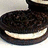 A pixelated image of a sandwich cookie with cream filling on a light background, next to pixelated text reading "oreos are yummy!!!" on a black background.