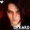 Two side-by-side pixelated frames of a person with long dark hair and orange eye makeup against a dark background, with text "GERARD" in blocky white letters at the bottom left frame.