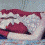A pixelated animation shows a person lying down with red and white bedding, transitioning to an orange lamp emitting light against a dark background.