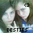 Two people in blue shirts pose together with one making a peace sign, text 'BESTIES' appears below them.
