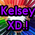 A pixelated image with a rainbow gradient background, featuring a white heart shape and purple text reading "Kelsey XD!" in the top-left corner.