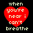 Four identical red heart-shaped icons with white text reading 'when you're near i can't breathe' on a black background, arranged in a