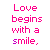 A static image displays repeated text in pink, red, and cyan colors on a white background with partial gray overlay.