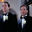 Two pixelated men in black tuxedos with white bow ties and light-colored boutonnieres against a gray background, appearing as static buddy icon imagery.
