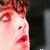 repeated anime-style character faces with red-tinged skin and curly hair, each face showing a slight variation in expression or position