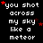 Pixelated text repeats 'you shot across my sky like a meteor' with red stars on black background, one gray square in bottom-right corner.
