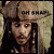 Pixelated static image of a person wearing a wide-brimmed hat with dark bands and long hair, set against a light textured background.