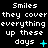 Pixelated text repeats 'Smiles they cover everything up these days' with cyan symbols changing : plus sign, star, and X