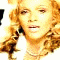 repeated, pixelated images showing a woman with curly blonde hair in various poses and expressions against blue backgrounds