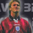 Static 48x48 pixel icon of a soccer player in red jersey with visible team crest, set against dark background with partial gray text elements.