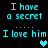 Pixelated cyan text on black background reads "I have a secret... I love him" with heart symbols appearing and changing color.