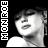 Pixelated grayscale image of a person's face with visible hair and shoulder, alongside vertical text reading 'MONROE' on the left.