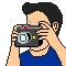 Pixel art of a person in blue clothing holding a camera, showing four sequential states with one frame displaying a yellow starburst effect.