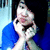 A person in a blue shirt with hands near their face, displayed across four showing slight variations