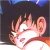 Pixelated close-up of a character's face with spiky brown hair, closed eyes, and visible ear against dark background.