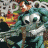 Animated sequence showing a skull with green hair and colorful background transitioning to two static skull icons.