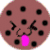 A pixelated cookie with black spots, a pink tongue, and a smiling face, alongside a blue Sesame Street character, a chocolate sandwich cookie, and rainbow text reading "THE LOVE COOKIE".