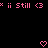 Pixelated pink text and symbols on black background with two heart shapes at bottom center.