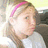 A pixelated image split into two sections: a person with light hair and pink headband on the left, and black text on bright pink background on the right.