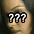 Pixelated image showing three white question marks with black outlines over a blurred background of light and dark tones.