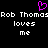 Pixelated text and a heart symbol on black background with repeated phrases.