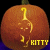 A 2x2 contact sheet of three animated frames showing a carved pumpkin with a glowing yellow cat silhouette and the text "KITTY" in different colors against a black background.