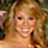 Static 48x48 pixel icon showing a close-up of a person with light brown hair and fair skin, smiling broadly against an indistinct background.