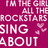 Pixelated text and heart symbols on split magenta-pink background with black text reading "cause I'm a... rockstar 2!".