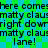 Pixelated text repeats 'here comes matty claus right down lane!' on a green and blue checkered background with black lettering.