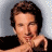 A pixelated image shows a person with brown hair resting their chin on one hand against a light gray background, next to green text reading 'OriginalIcons.com' on dark green.