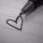 A black-and-white image split into four quadrants showing a pen drawing a heart, text about love at first sight, and the word 'or.'