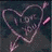 A static pixelated image of a stylized, abstract figure with flowing pink and purple lines against a dark background.